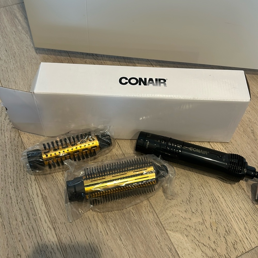 Contain never used blow dryer brush with 2 attachments